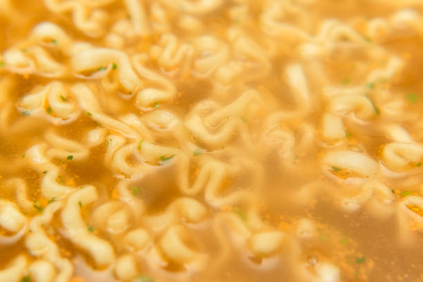closeup noodle soup with seasoning