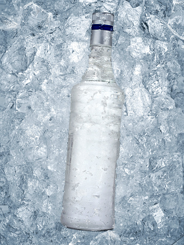 Close up Liquor bottle in ice