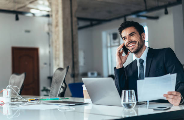 istock Young businessman working at office 1235804195