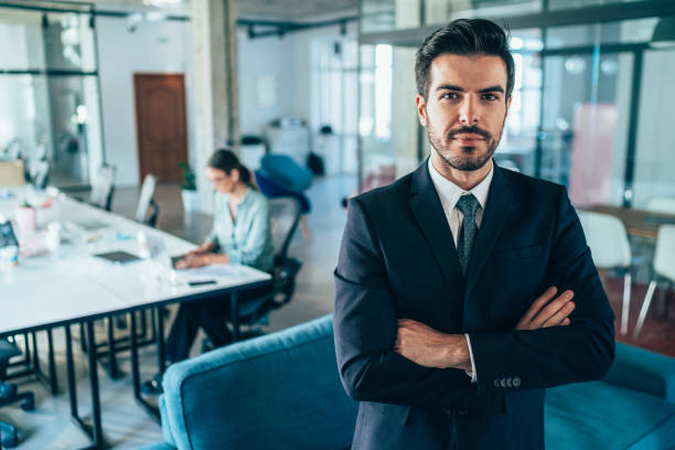 istock Confident businessman at office 1235804196