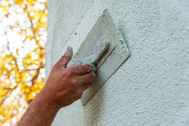 Application Of Facade Plaster. Application Of Facade Plaster,Worker Plastering The Facade Of The Building, Close-Up. rough hands man stock pictures, royalty-free photos & images