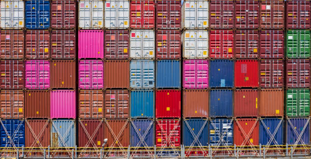 istock Multicolor shipping containers stacked high at a port. 1235833062