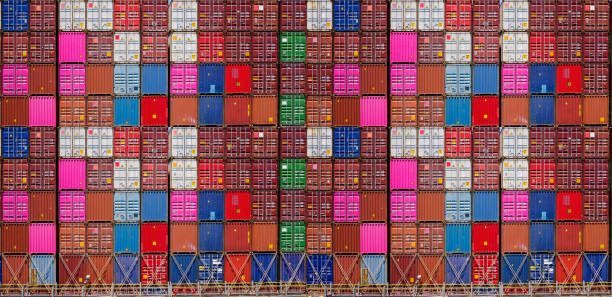 istock Multicolor shipping containers stacked high at a port. 1235834618