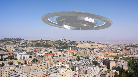 Alien Saucer Spaceship Hovering Over Jerusalem Old City\n3D illustration Compositing with real Drone View /Israel.