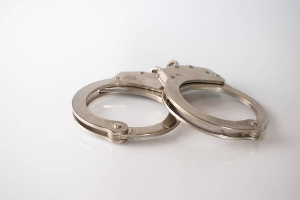 istock steel metal Handcuffs on  white background isolate 1235856531