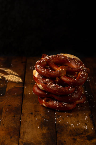 German Brezel pretzel with salt on wooden background