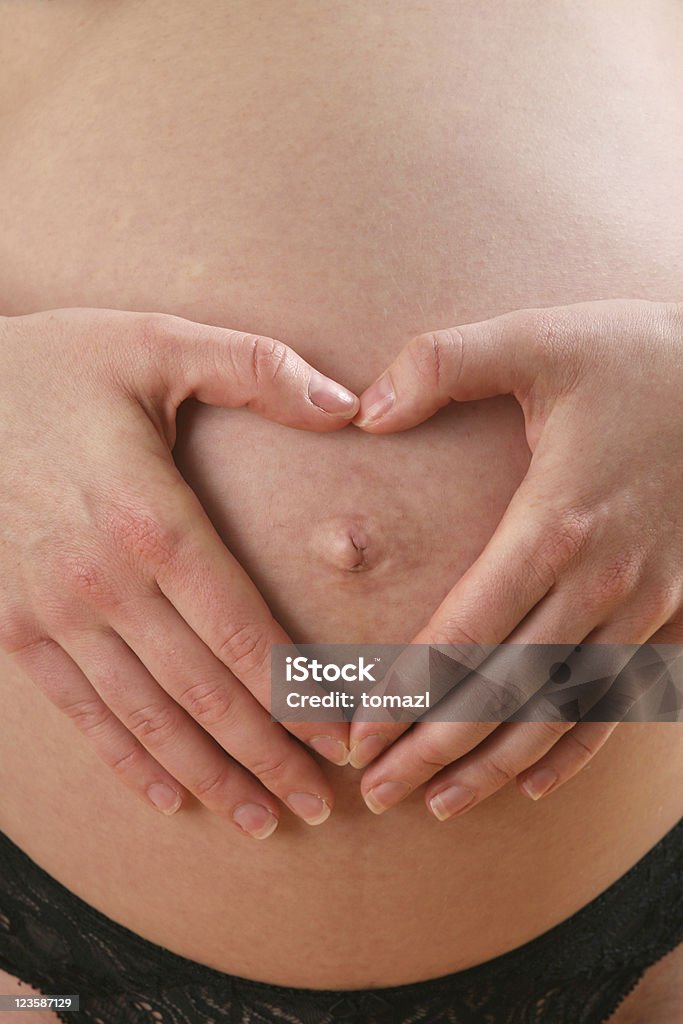 Corazón en big belly - Foto de stock de Abdomen libre de derechos