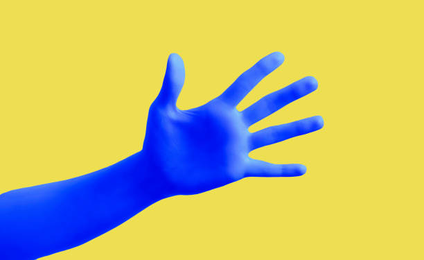 istock Blue hand gesture on yellow background poster. Open palm and five fingers. 1235873035