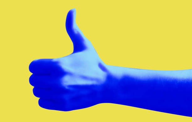 istock Blue hand gesture on yellow background poster. Thumb up. Like. 1235873043