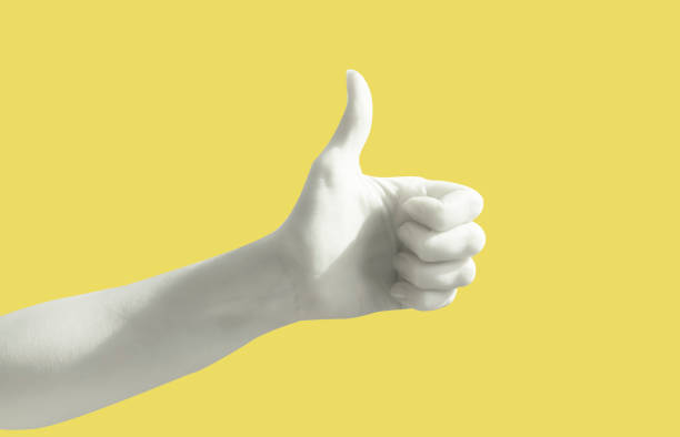 istock Hand gesture on yellow background poster. Thumb up. Like social web. 1235873049