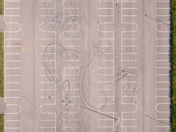 istock Aerial top down drone shot. Parking with tire tracks. 1235886102