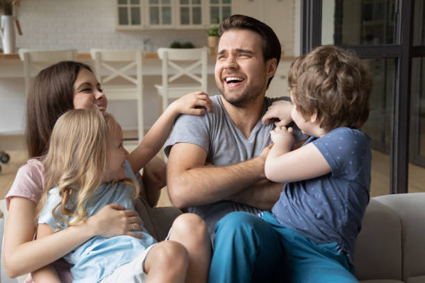 istock Happy young family have fun playing together 1235944519