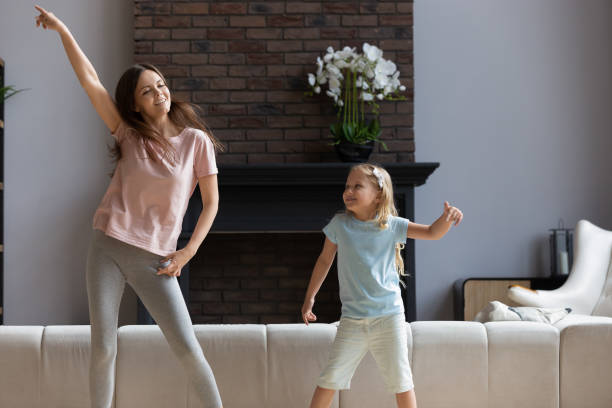 istock Overjoyed young mom have fun dancing with daughter 1235945052
