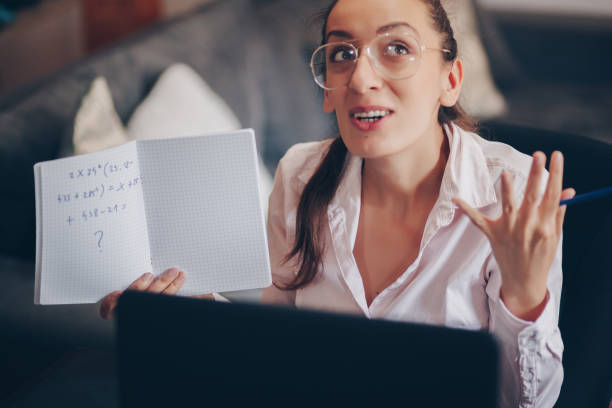 istock Teacher woman teaching remotely from home 1235966926