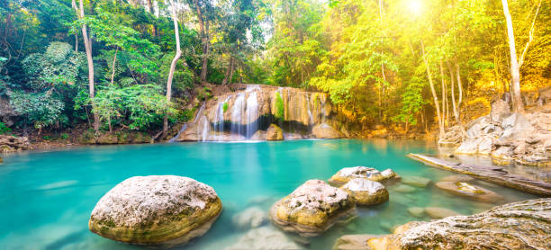 panorama of beautiful waterfall in wild rainforest in erawan national park, thailand - erawan falls fotos imagens e fotografias de stock