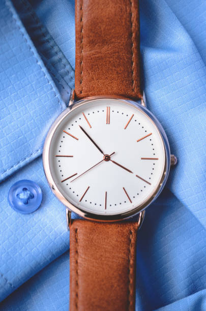 istock Leather watch on a blue shirt. For business 1235991697