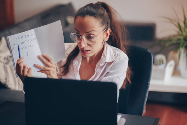 istock Teacher woman teaching remotely from home 1235992208