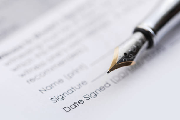 istock Fountain pen and business contract 1236019454