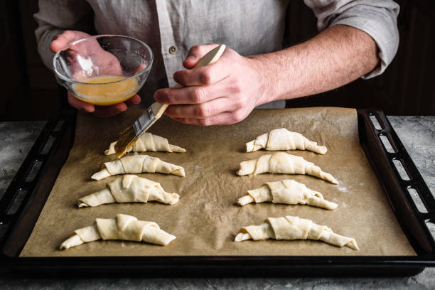 istock Baking sheet of raw croissants stuffed with chocolate spread 1236035551