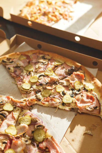 istock Delicious pizza slices in cardboard box 1236048110