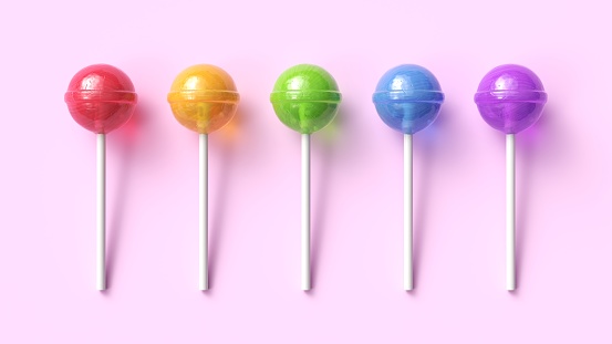 Set of five colorful sweet lollipops on pink pastel background. Round candies on stick. 3d rendering