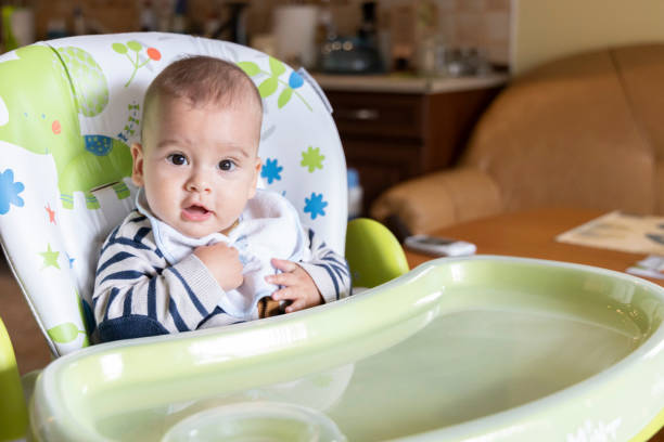 istock a little baby eating at home 1236060254