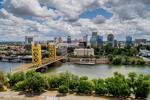 High quality stock aerial view photo of Sacramento's Tower Bridge and the Sacramento River, looking towards the Capitol mall and building.