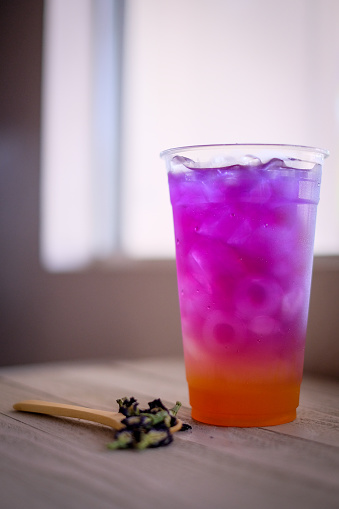 colorful layer of pink and purple herb tea. Butterfly pea tea cold drink for refreshment.