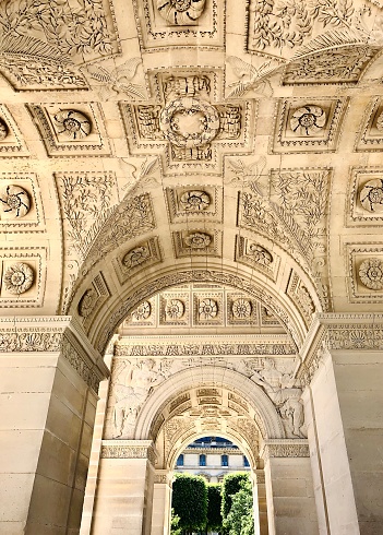 Vault of Carroussel triumphal arch seen from below, near Louvre museum in Paris. Low angle view