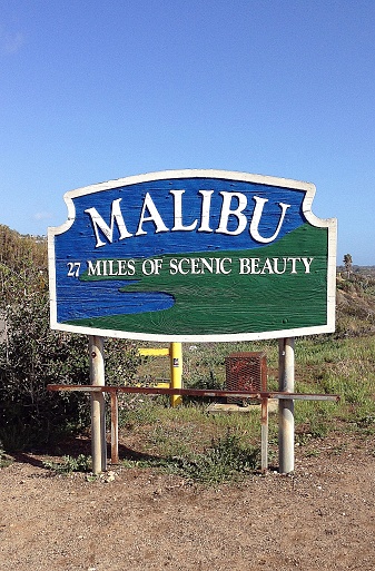 View of a Malibu town sign. 27 miles of scenic beauty