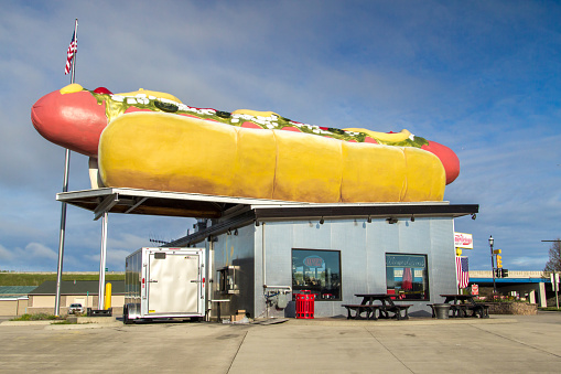 Mackinaw City, Michigan, USA - May 30, 2020: Exterior of Wiernerlicious  hot dog stand. The store bills itself as having the worlds largest wiener on top of it's building.