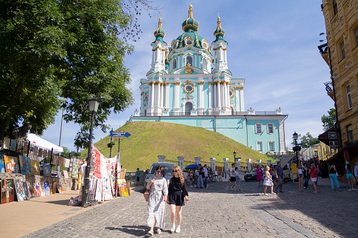 Kiev, Ukraine - June 10, 2018. Andreevsky descent in Kiev - is one of the ancient ways connecting the Upper city, its central part, with the trading Podol. St. Andrew's Church