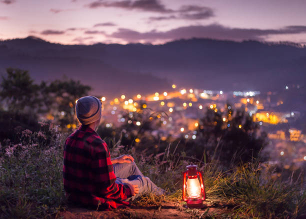 istock Young man with a lit kerosene lamp 1236248957