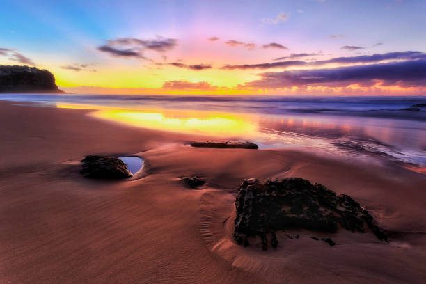 istock Sea Bungan B dark sand 2 stones 1236284778