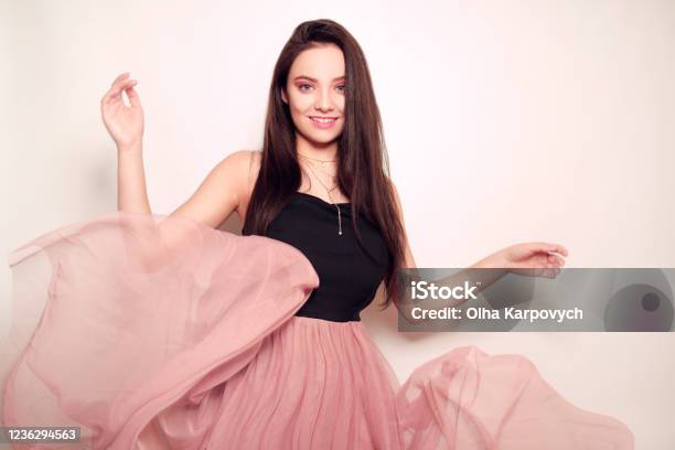 Beautiful Lady in Luxury Lush Pink Dress. Fashion Brunette Smiling Woman in  Gorgeous Long Gown Posing Isolated on White Studio Ba Stock Photo - Image  of fashionable, healthy: 102686710