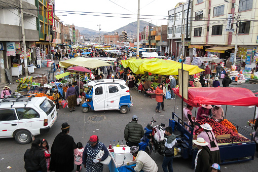 Puno, Peru - Sep 17, 2016: Typical scene in a crowded street market of Puno