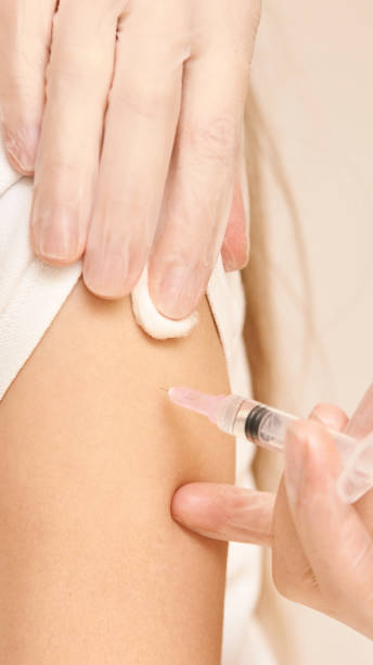 istock Doctor do injection to young girl. Kid immunization 1236465773