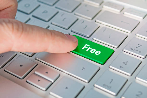 istock Enter key and word Free button modern pc text communication board. Free inscriptions on the grey silver keyboard button close up 1236468960