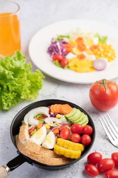 istock Vegetable salad with bread and boiled eggs in the pan. Selective focus. 1236476747