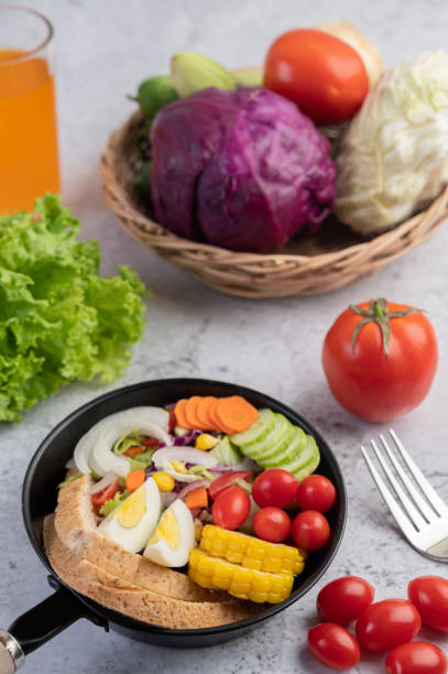 istock Vegetable salad with bread and boiled eggs in the pan. Selective focus. 1236477795