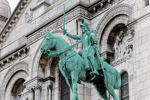 Equestrian statue of of Saint Joan of Arc at the Basilica of the Sacred Heart of Paris, at the summit of the butte Montmartre, the highest point in Paris, France