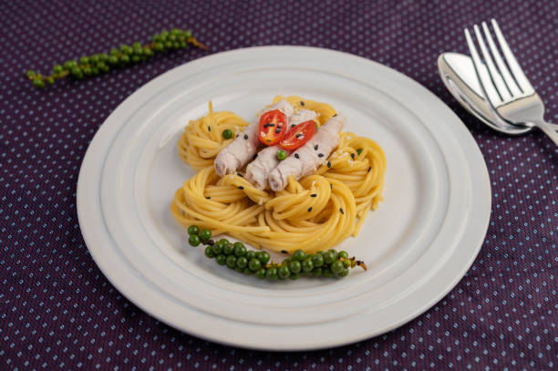 istock Stir-fried spaghetti and pork, beautifully arranged in a white plate. 1236490754
