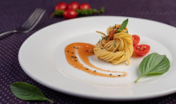 istock Stir-fried spaghetti beautifully arranged in a white plate. 1236491262