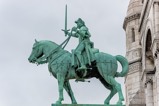 Equestrian statue of of Saint Joan of Arc at the Basilica of the Sacred Heart of Paris, at the summit of the butte Montmartre, the highest point in Paris, France