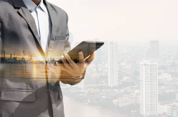 istock double exposure city and businessman using smartphone searching with internet online networking. device mock up mobile phone texting communication connecting. 1236561620