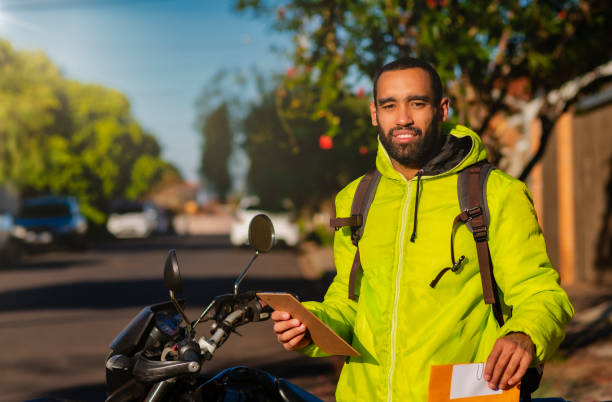 istock African american delivery man performing delivery 1236586457