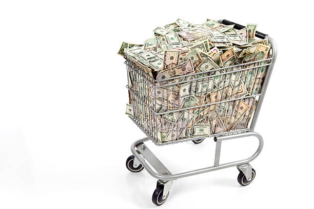 Shopping Basket Full of Money stock photo