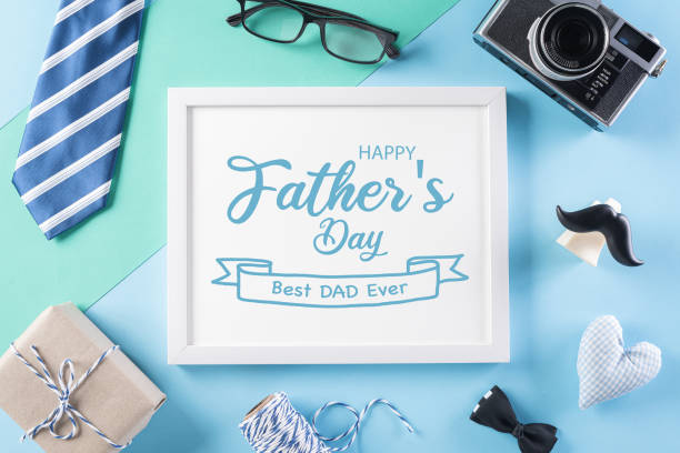 istock Happy Fathers Day background concept with picture frame, retro camera, decorated bowtie, necktie, eyeglasses, gift box and mustache on bright pastel background. 1236675940