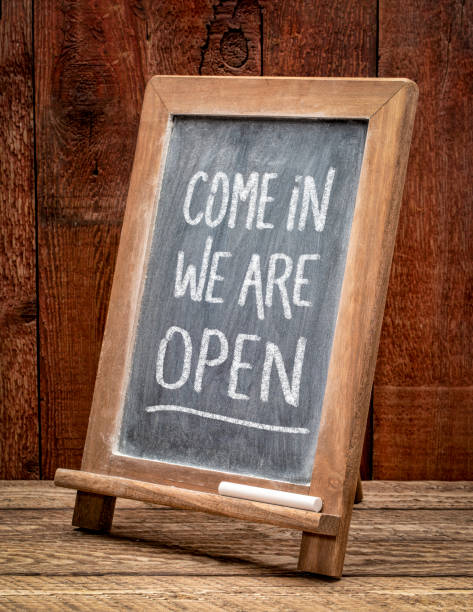 istock Come in, we are open invitation, blackboard sign. 1236685110