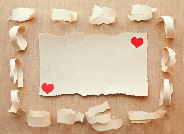 istock Paper with ripped edges on fabric background. Valentine Card 123674147